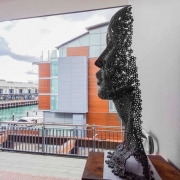 facehead sculpture in metal