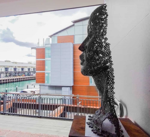 facehead sculpture in metal