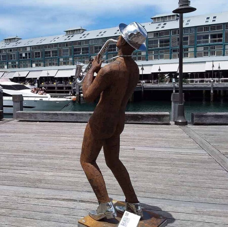 Corten & Stainless Steel Figurative Sculpture – Saxxy and You Know It by Nicole Allen, 198x58x48cm
