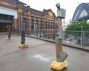 poets-scoundrels bronze totem sculpture in sydney