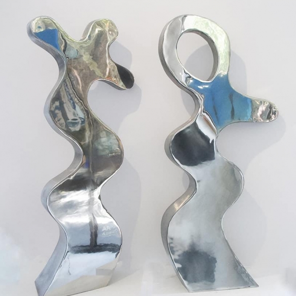 polished stainless steel free-standing // table-top sculptures abstracted figures