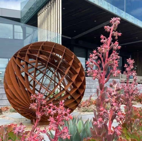 Corten Steel Round & Sphere Sculpture – Dual Axis by Paul Mutimer, 120cm Diameter | ARTpark Australia