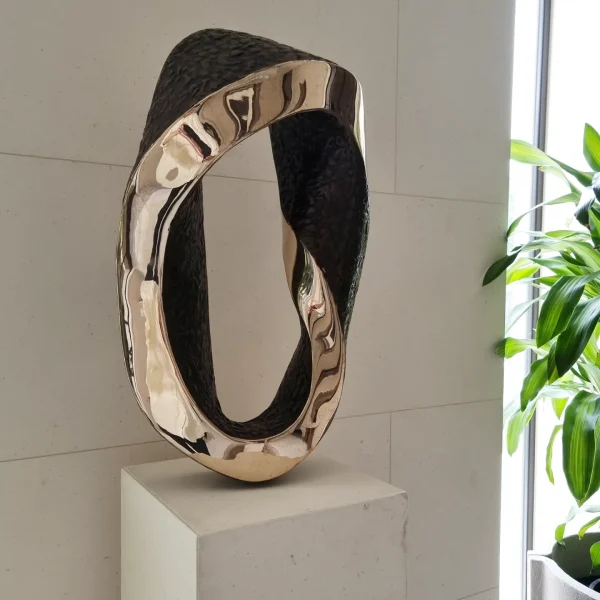 Mobius Curve - polished bronze interior sculpture