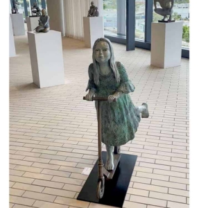 girl child bronze sculpture