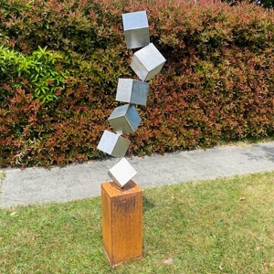 Corten and stainless steel garden sculpture