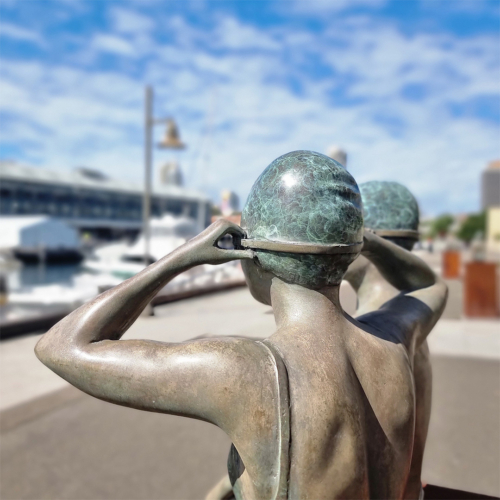 Bronze Figurative Sculpture – On the Edge by Mela Cooke, 77cm on 100cm Corten Plinth | ARTpark Australia