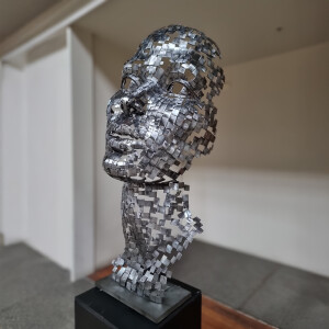 metal face sculpture