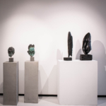bronze interior sculpture, bookshelf sculpture,